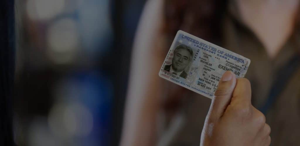 Person holding an identification card