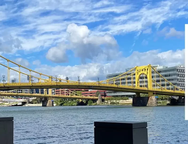 Yellow bridge over calm water
