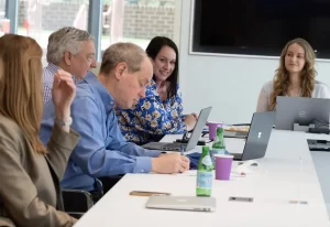 Jessica Johnson Bennett discusses government affairs with AJW's Mary Solecki, Rich Kassel, Bill Tyndall, and Jordan Flanagan